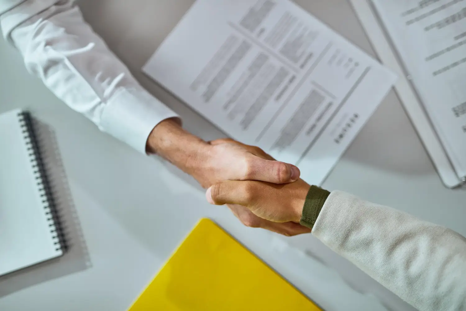 Person reviewing staff documents for recruitment and staffing services